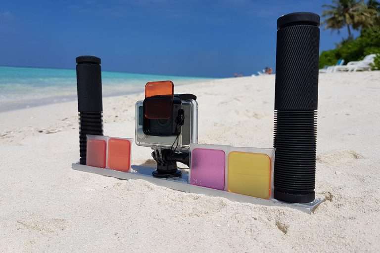 GoPro camera in the sand with a tray and red filter