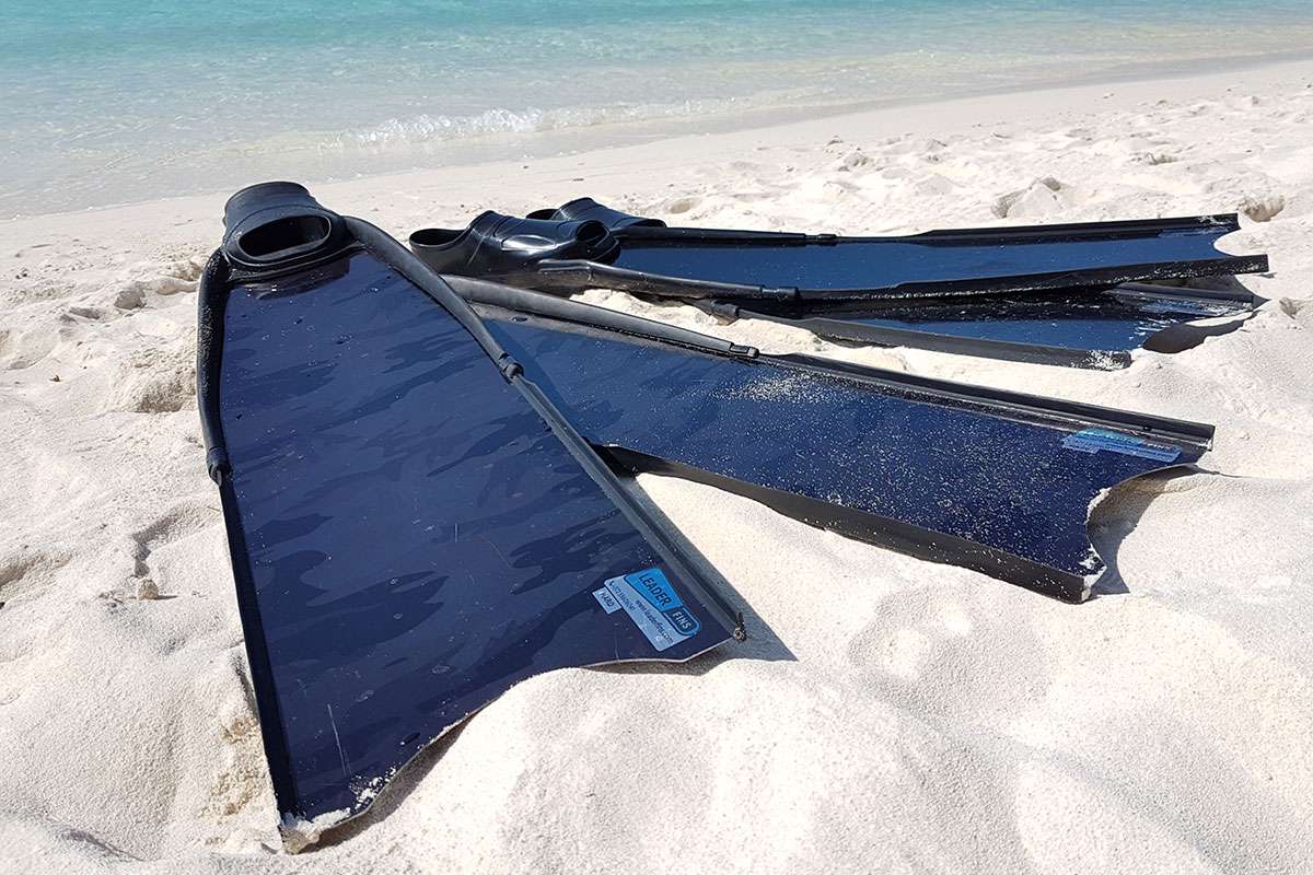 long blade freediving fins in the sand