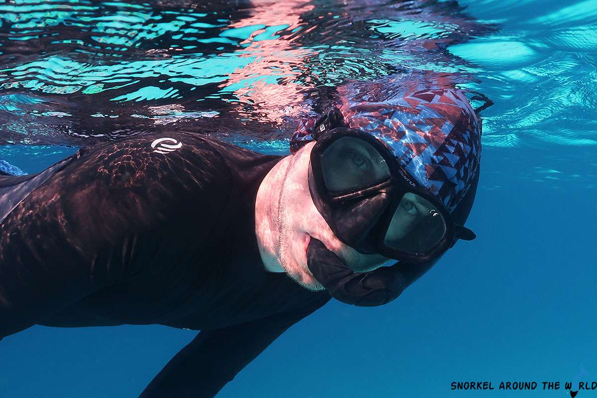 Snorkeler wearing two window snorkeling mask