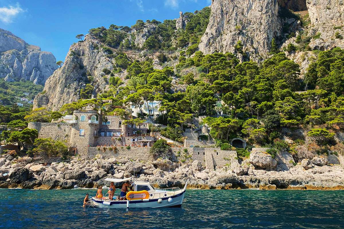 people on small boat along Capri coast