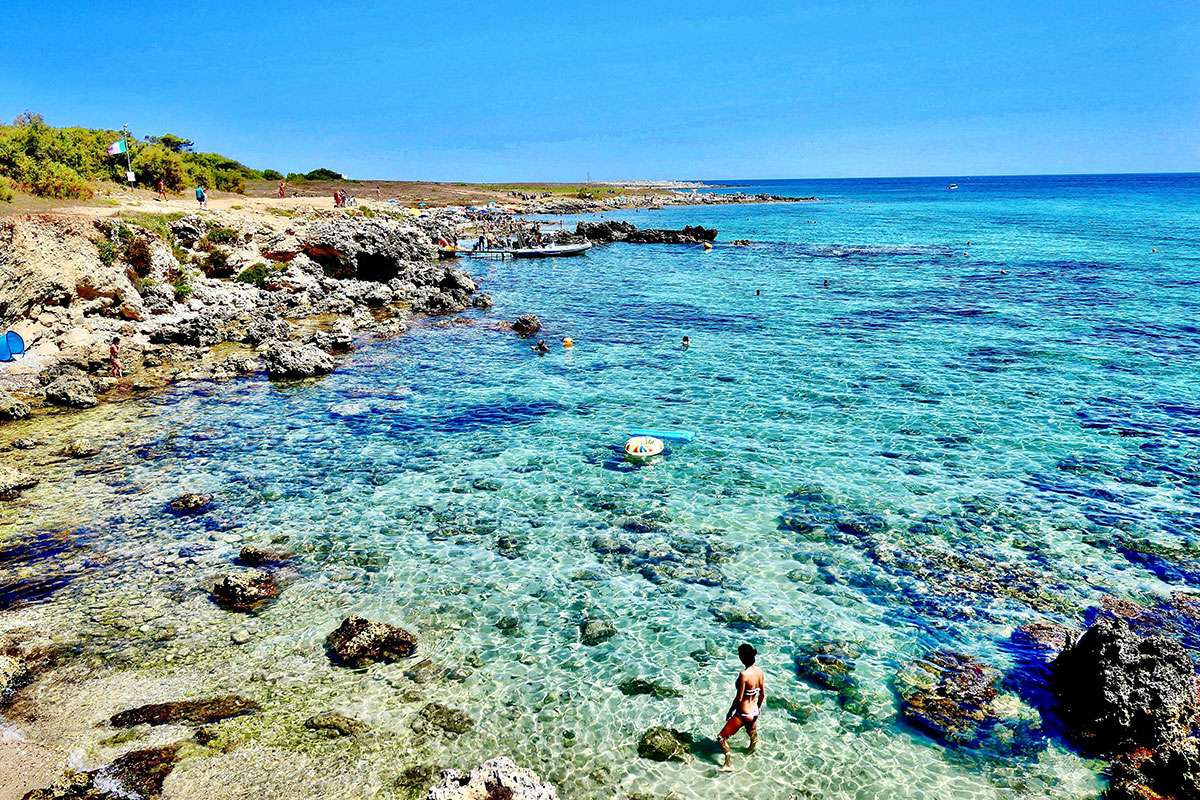 people swimming in the sea in summer in Italy